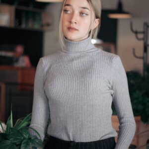 woman wearing gray turtle-neck sweater