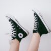 black and black and white Converse All Star high-top sneakers